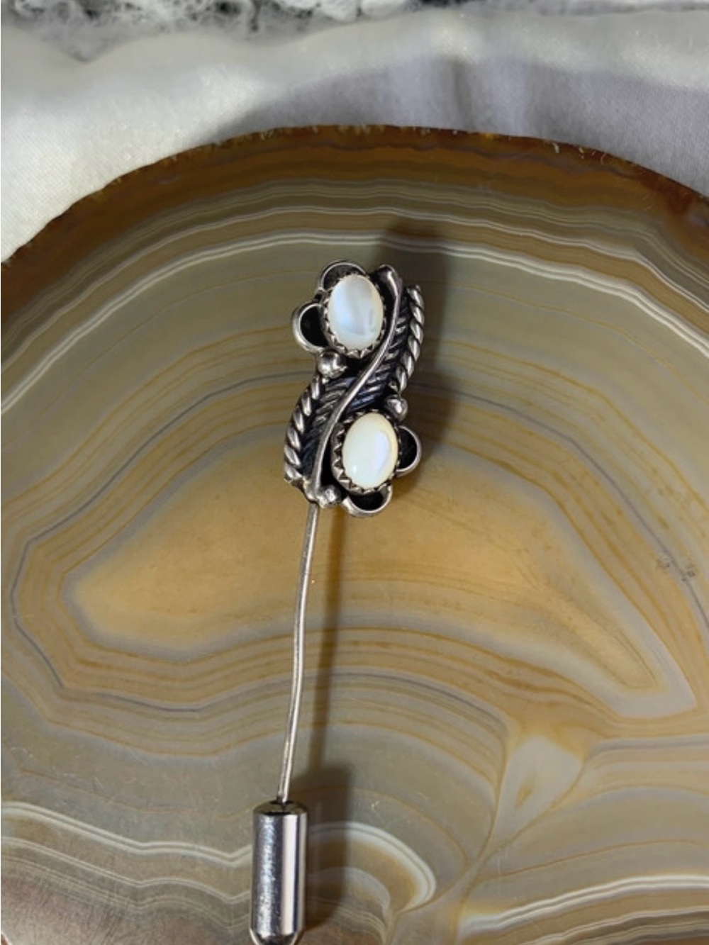 Vintage sterling silver mother of pearl native style stick pin.